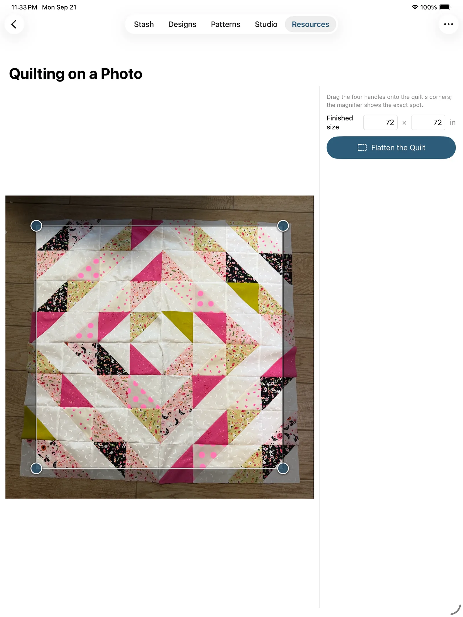 Pinning the corners of a photographed quilt top